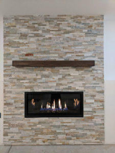 New mantel and stone fireplace with electric fireplace insert