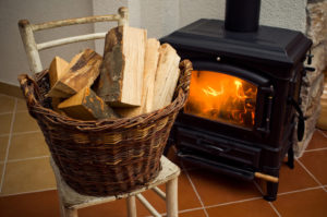 basket of wood with black stove